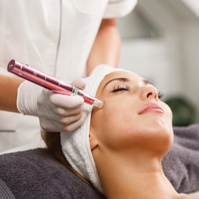 shot-beautiful-young-woman-facial-dermapen-micro-needling-treatment-beauty-salon